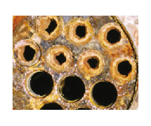 Clearing of solid deposits from inner surfaces of metal pipes